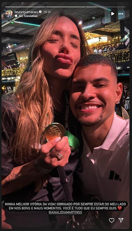 Club captain Bruno Guimaraes posed for a selfie with his wife Ana Lidia Martins (left)